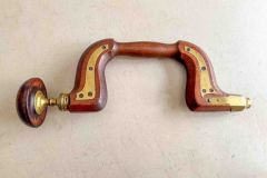 65  Brass Plated wooden brace, unknown maker